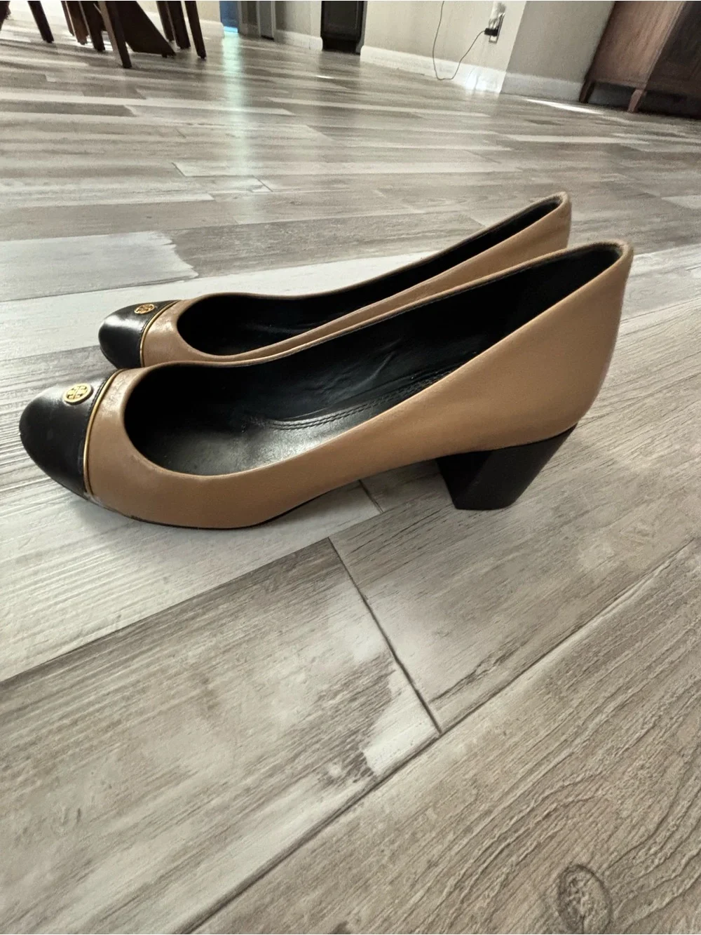 Tory Burch Two-Tone Tan and Black Cap-Toe Pumps with Gold Logo